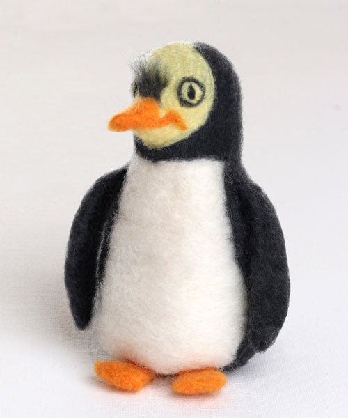 Sample of a needle felted penguin on a white background