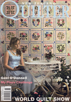 Magazine cover featuring a woman reading a book with a quilt in the background