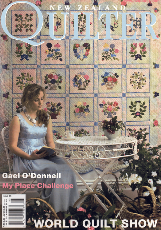 Magazine cover featuring a woman reading a book with a quilt in the background