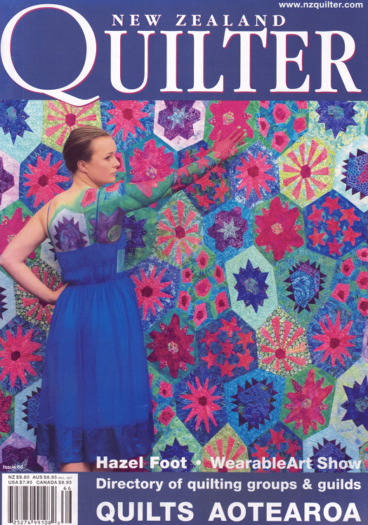 Magazine cover featuring a woman in a blue dress standing next to a colorful quilt with 'New Zealand Quilter' branding.