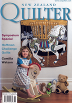 Magazine cover titled 'New Zealand Quilter' featuring a child with a rocking horse and quilted carousel.