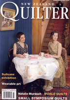 Magazine cover titled 'New Zealand Quilter' featuring two women at a table with a quilt.