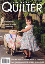 Magazine cover featuring a young girl with a quilted pram, titled 'New Zealand Quilter'.