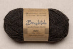 Close-up of dark brown-grey with a tweedy texture