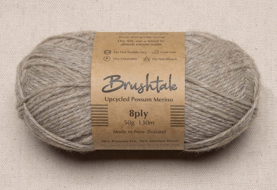 Close-up of dark beige yarn with a tweedy texture