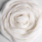 Sample of white unspun fibre for use in spinning or felting