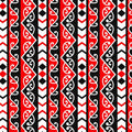 A Quilt fabric with Maori design featuring geometric shapes in red, black, and white colors.
