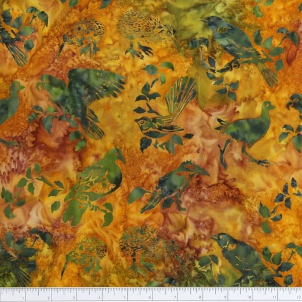 New Zealand designed quilt fabric with birds and floral elements on a textured background in oranges, greens and blues