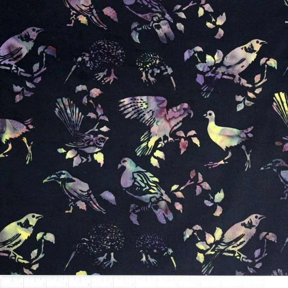 New Zealand designed quilt fabric with birds and floral elements in vibrant purples pinks and yellows on black