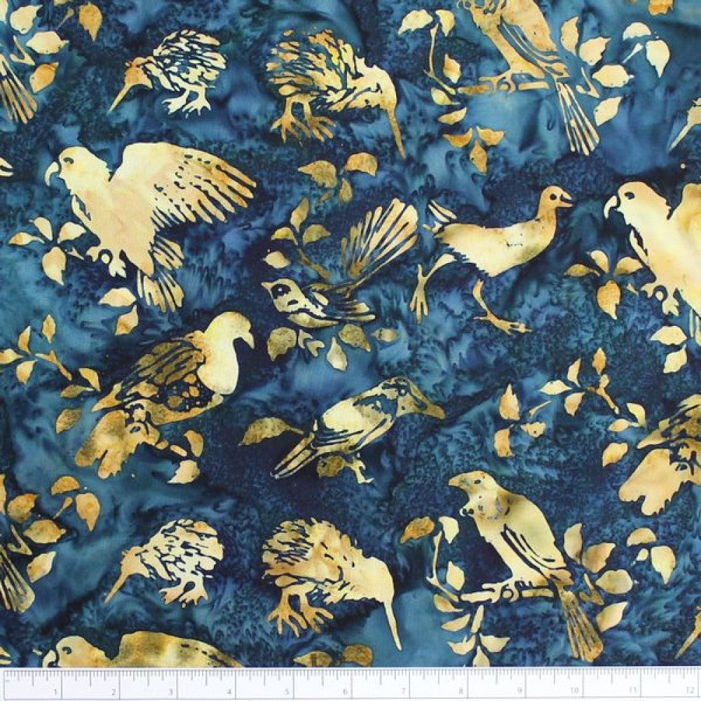 New Zealand designed quilt fabric with birds and floral elements on a textured background of beige on blues