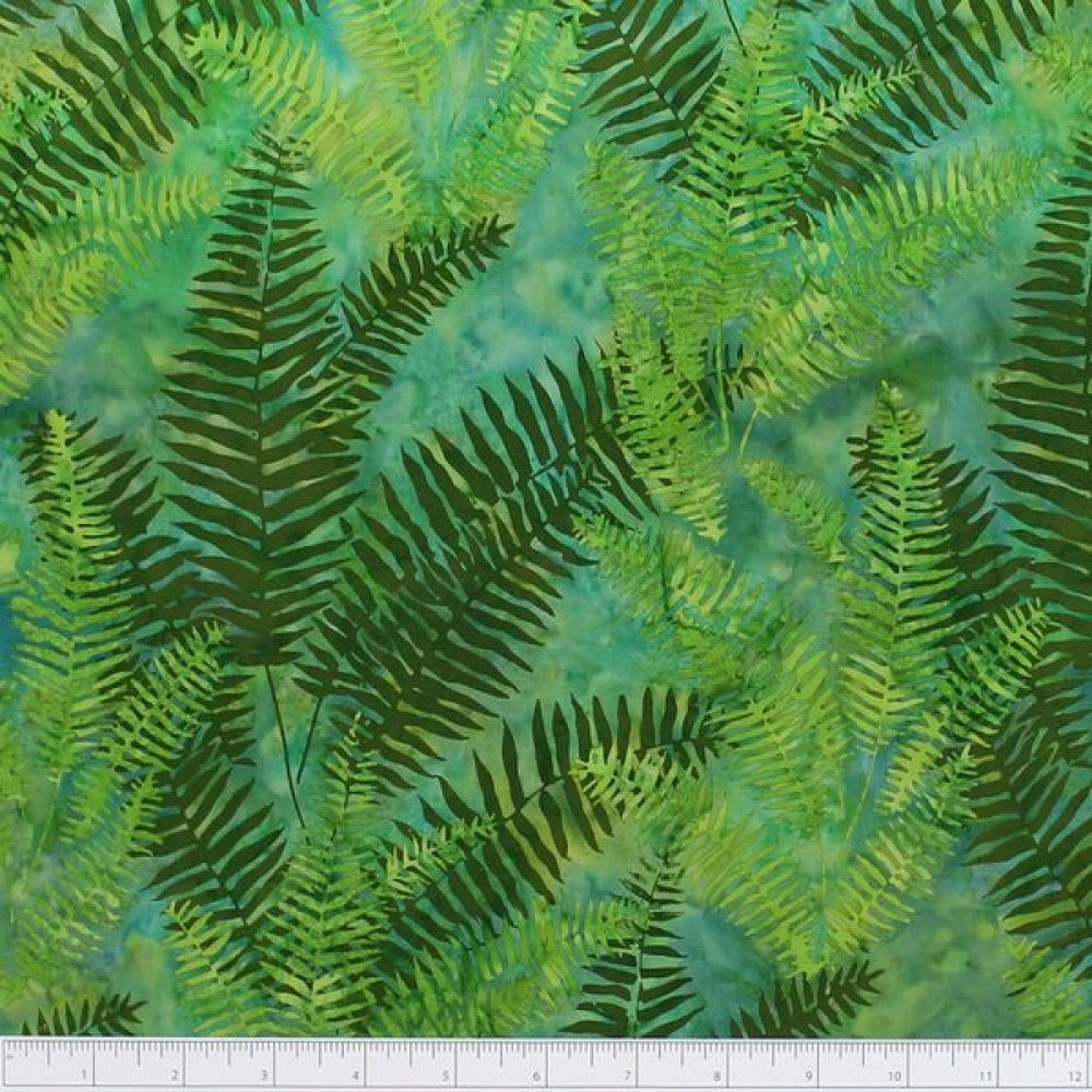 New Zealand designed quilt fabric with ferns on a textured background in shades of green and emerald
