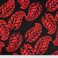 New Zealand designed quilt fabric with Maori style leaf design in red on black