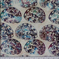 New Zealand designed quilt fabric with Maori style paua (abalone) design in turquoise and purple on off-white