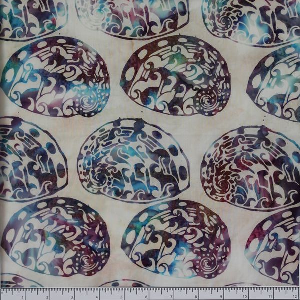 New Zealand designed quilt fabric with Maori style paua (abalone) design in turquoise and purple on off-white