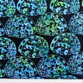 New Zealand designed quilt fabric with Maori style paua (abalone) design in turquoise green on black