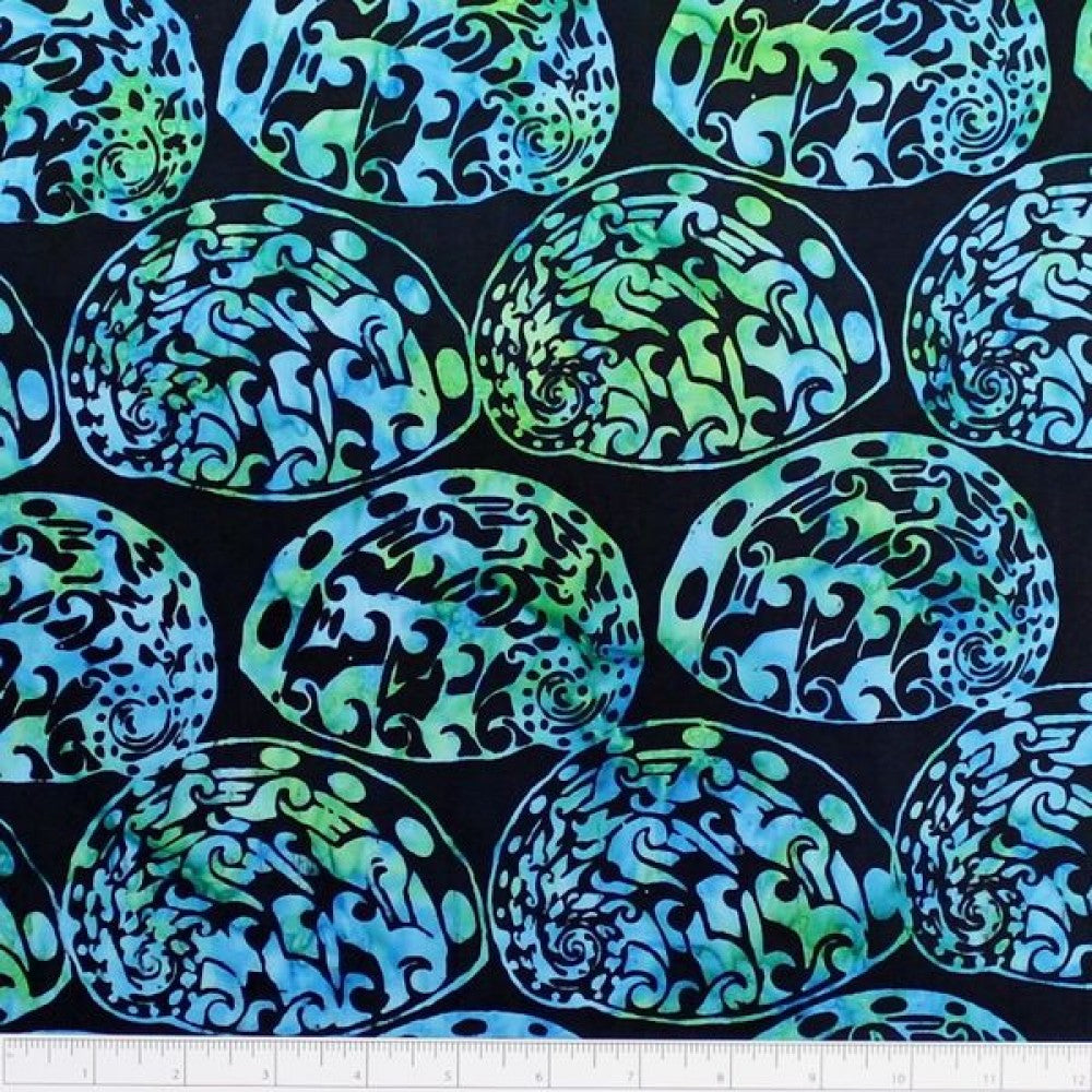 New Zealand designed quilt fabric with Maori style paua (abalone) design in turquoise green on black