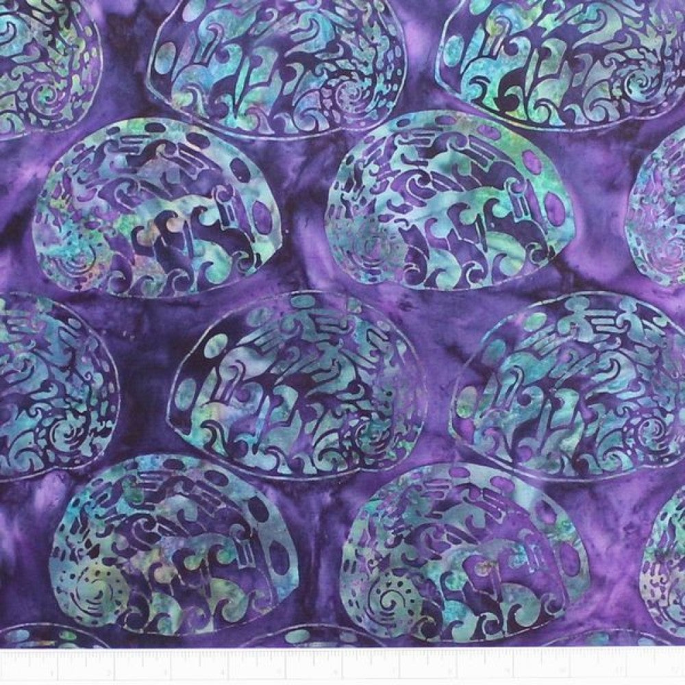 New Zealand designed quilt fabric with Maori style paua (abalone) design in turquoise and green on purple