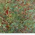 New Zealand designed quilt fabric with Maori style swirls design in green on rusty-brown