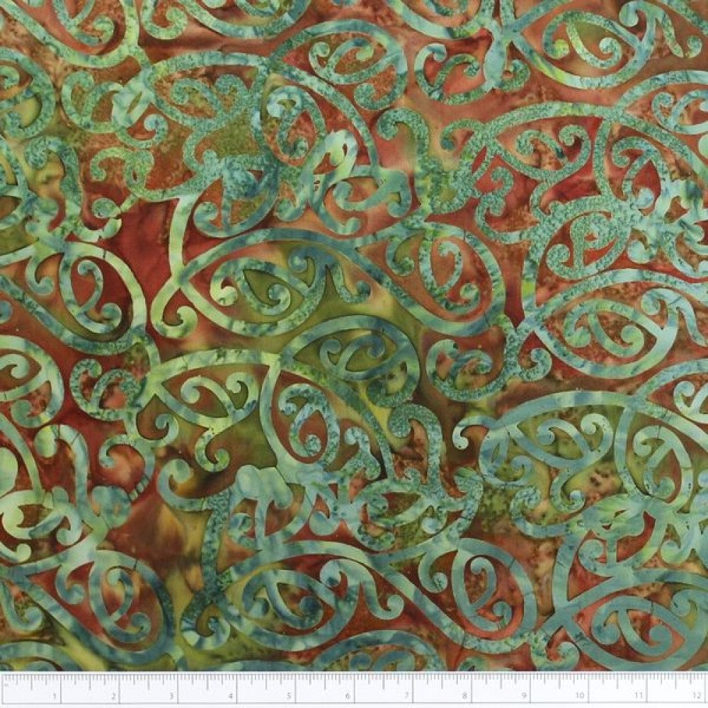 New Zealand designed quilt fabric with Maori style swirls design in green on rusty-brown