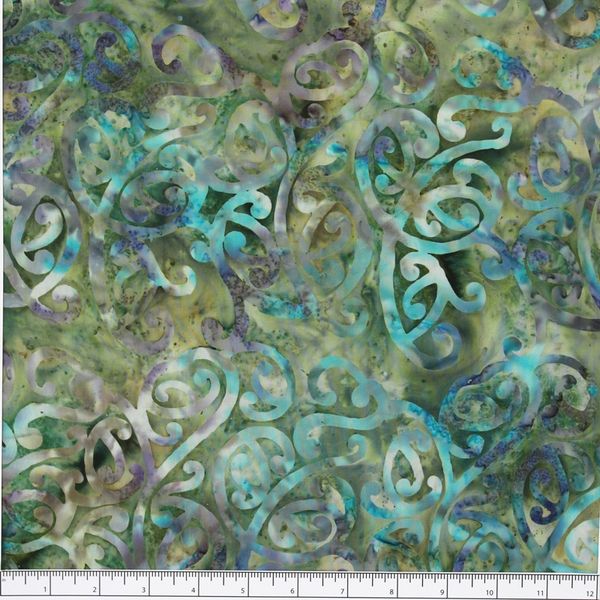 New Zealand designed quilt fabric with Maori style swirls design in turquoise green beige and purple