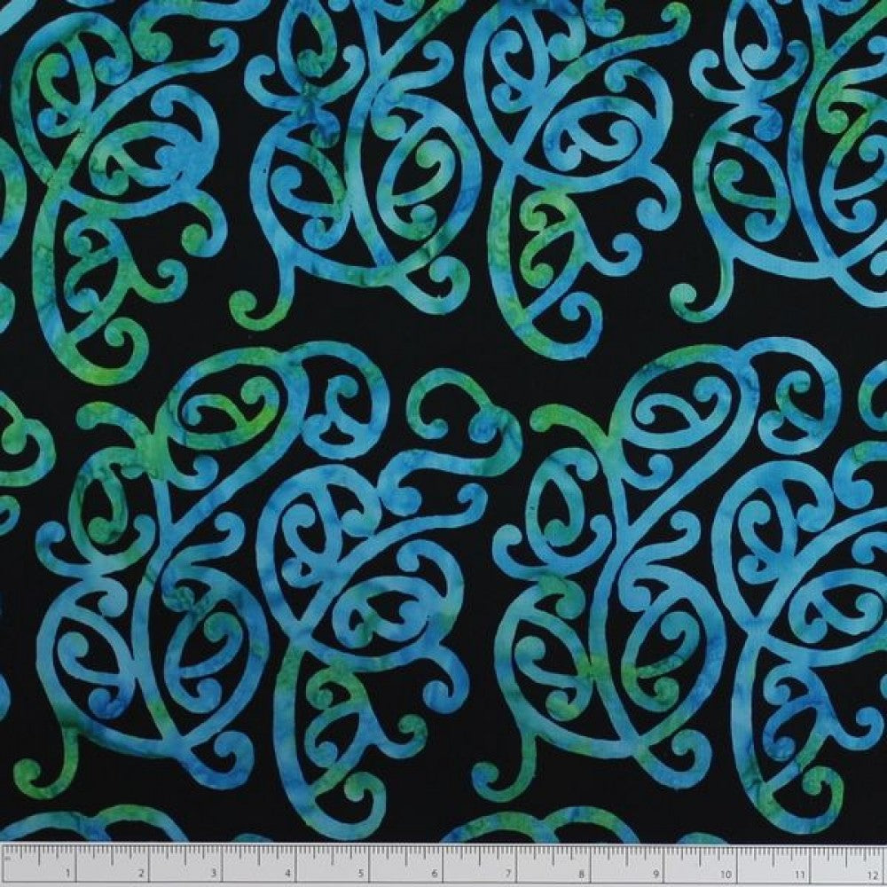 New Zealand designed quilt fabric with Maori style swirls design in turquoise and green on black