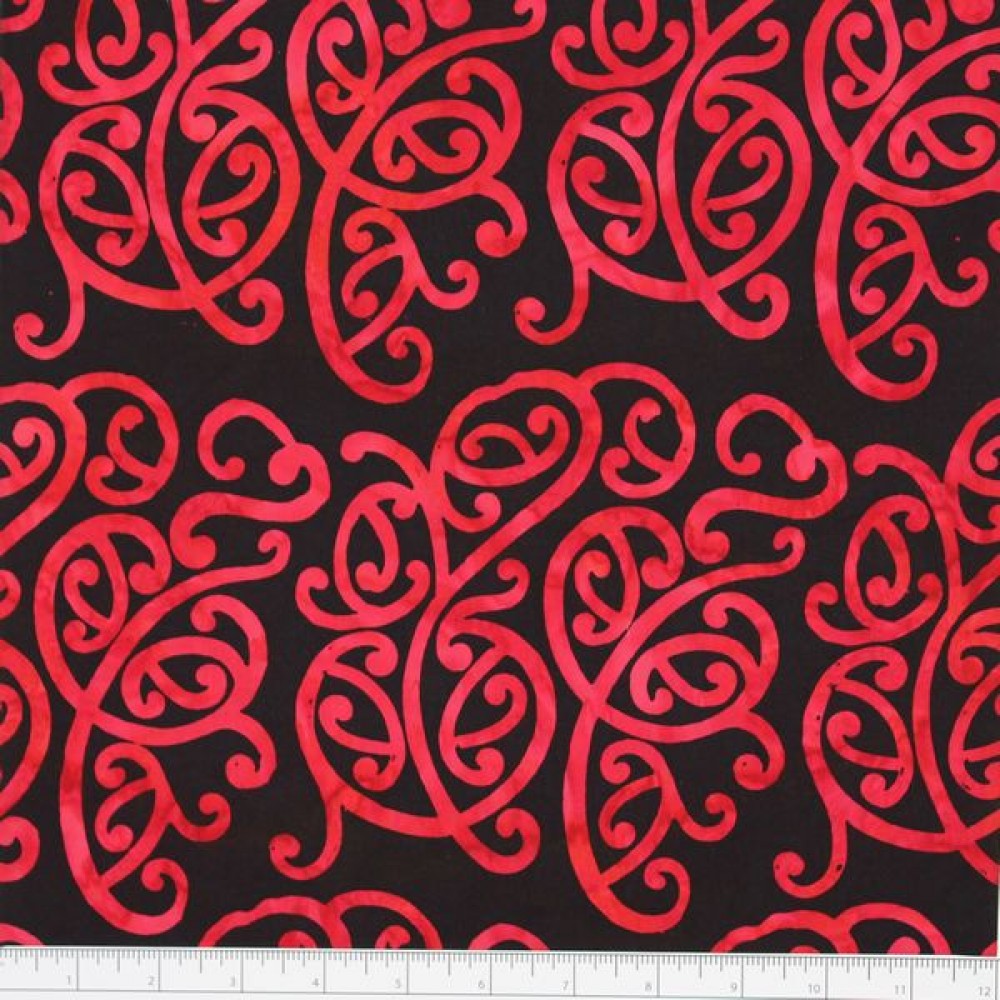 New Zealand designed quilt fabric with Maori style swirls design in red on black 