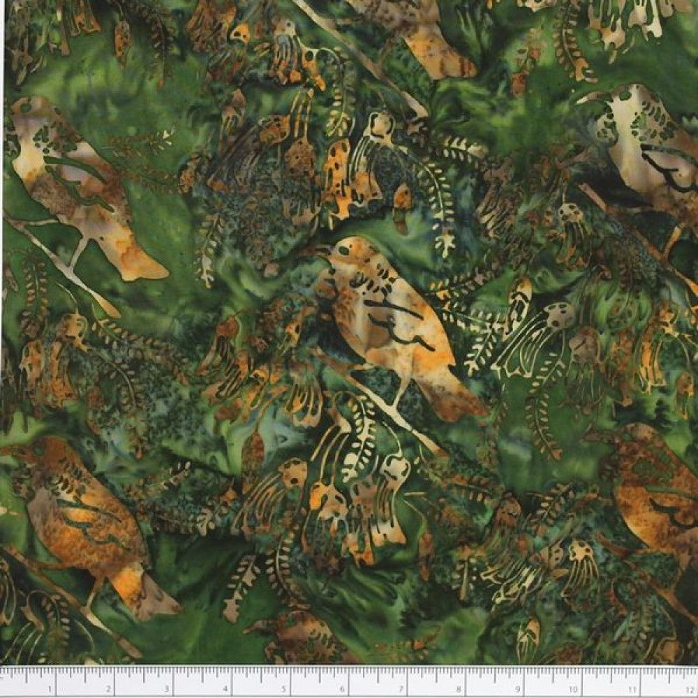 New Zealand designed quilt fabric with Tui birds and floral elements on a textured background in greens yellows and browns