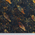 New Zealand designed quilt fabric with Tui birds and floral elements on a textured background in beige yellow and purple on navy