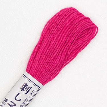 Skein of Olympus Sashiko Thread in colour hot pink on white backgound