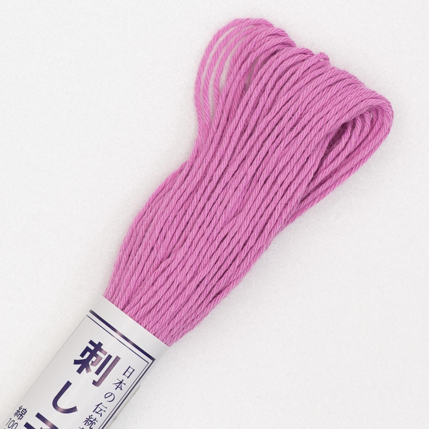 Skein of Olympus Sashiko Thread in colour orchid pink on white backgound
