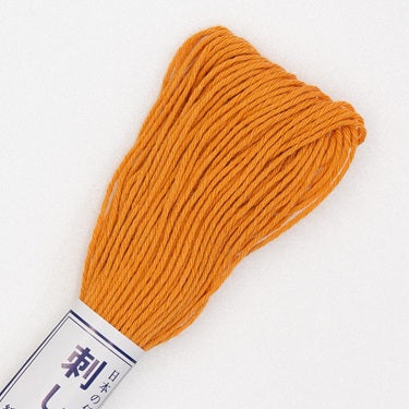 Skein of Olympus Sashiko Thread in colour pumpkin on white backgound