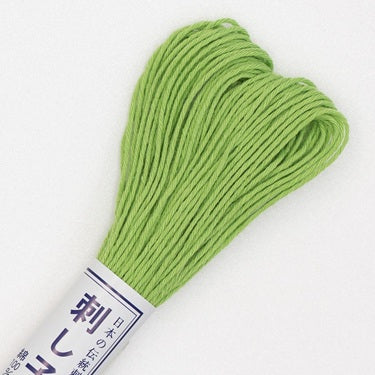Skein of Olympus Sashiko Thread in colour lime green on white backgound