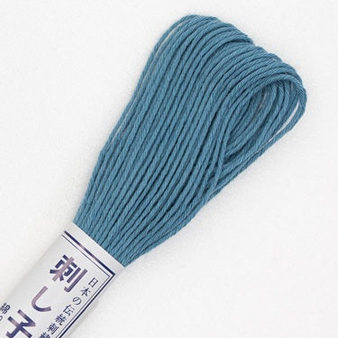 Skein of Olympus Sashiko Thread in colour denim blue on white backgound