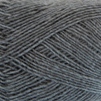 Close-up of a ball of mediuim slate blue yarn with a textured pattern