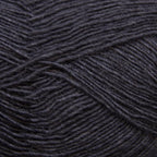 Close-up of a ball of dark charcoal yarn with a textured pattern