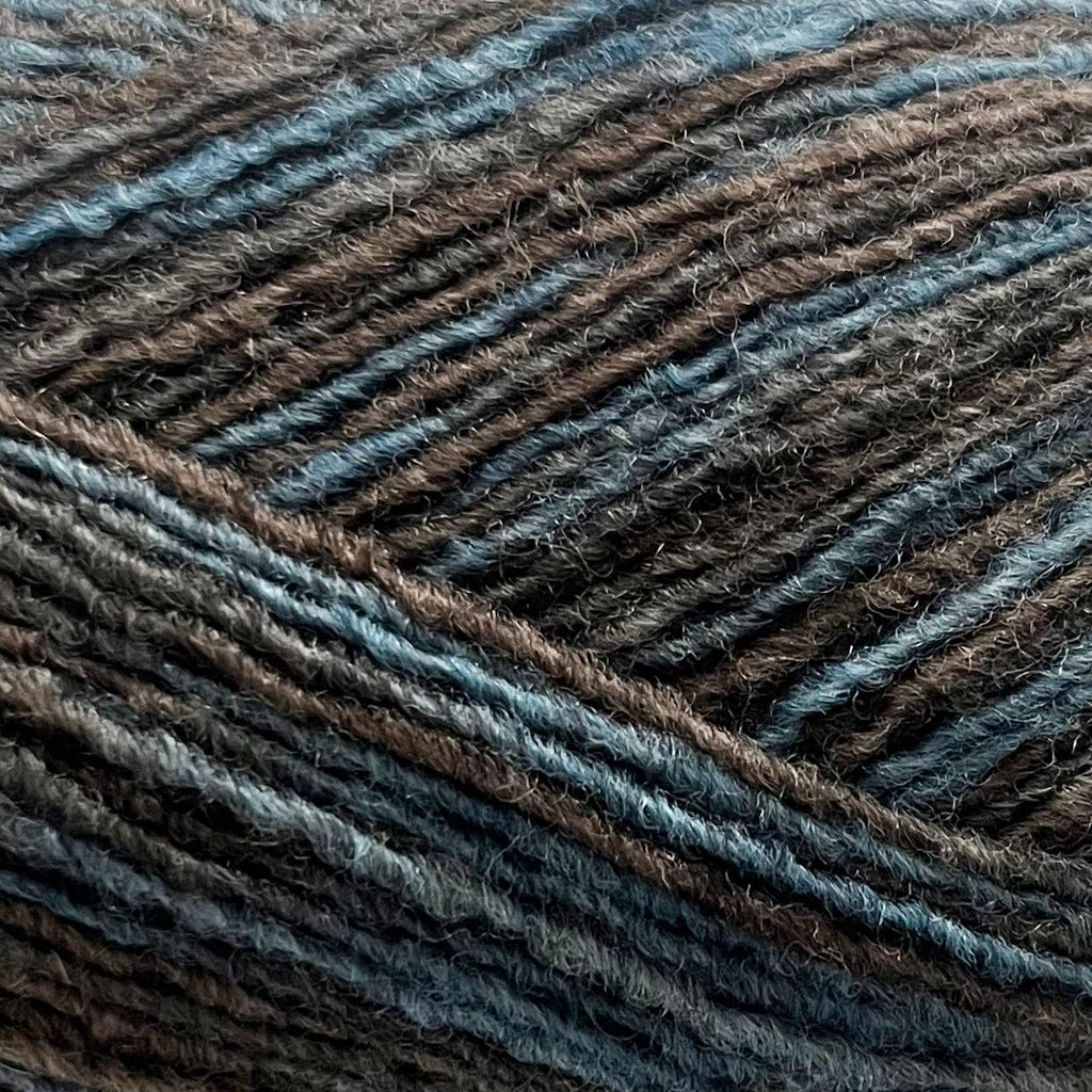 Close-up of brown and blue toned yarn with a textured pattern 