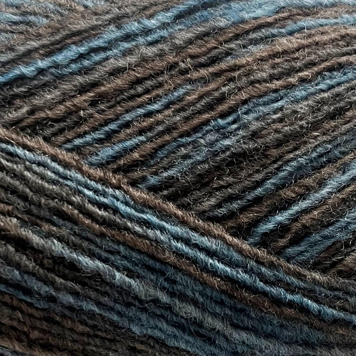 Close-up of brown and blue toned yarn with a textured pattern 
