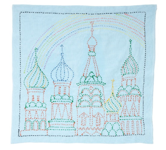 Embroidered design of a Russian Palace with a rainbow on a light blue background