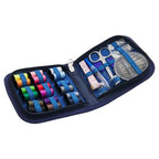 Sewing kit with colorful thread spools, scissors, and other tools in a blue case on a white background