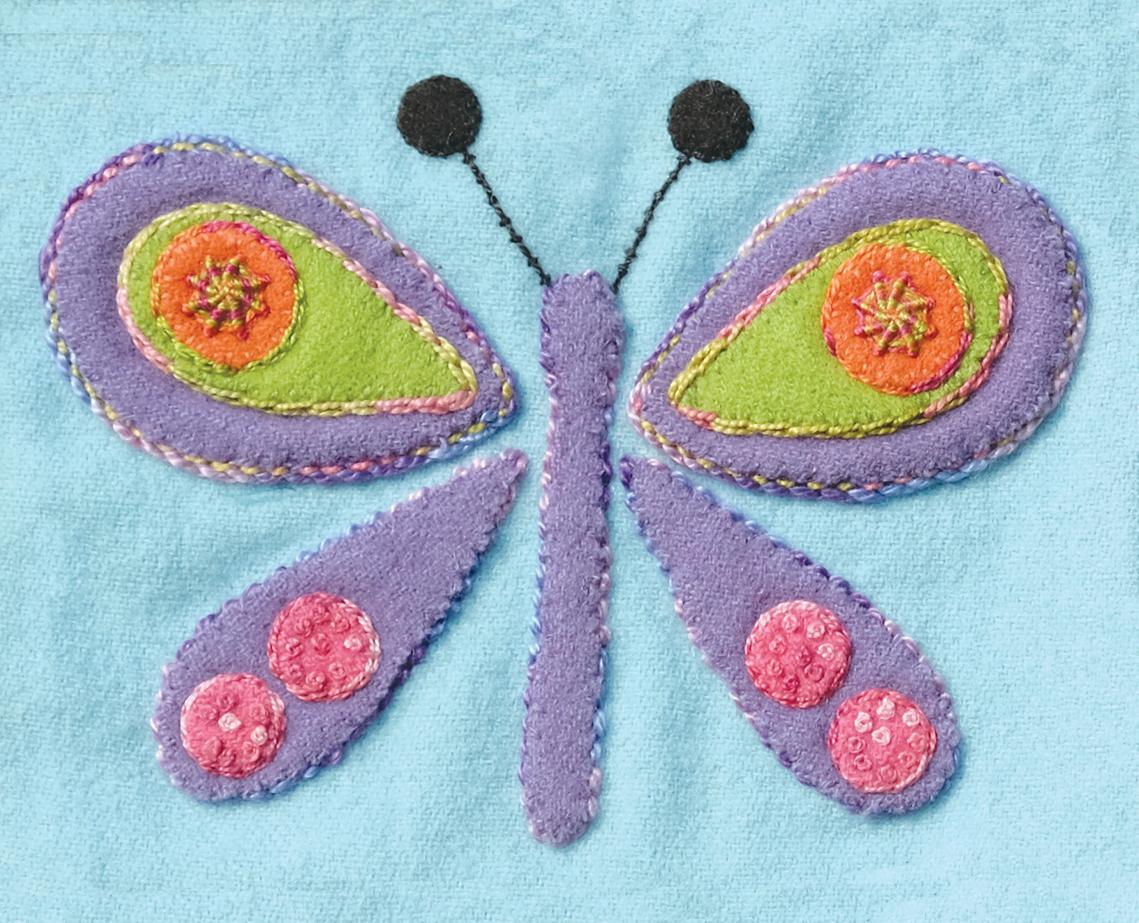 Colorful butterfly patch on a light blue background
