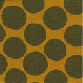 A fabric with a pumpkin orange background featuring olive green circles distributed evenly across the surface.
