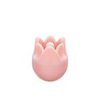Close up of Pink tulip-shaped knitting needle point protector on a white background