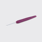 Purple crochet hook on a light gray background