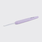 Lavender crochet hook on a light gray background