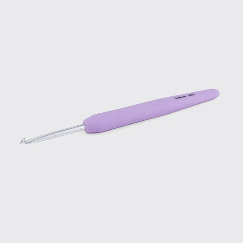 Light purple crochet hook on a light gray background