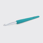 Dark teal crochet hook on a light gray background