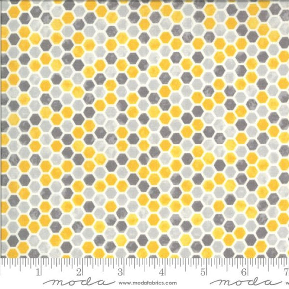 Honeycomb in yellows and greys on a white background