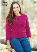 A cover image of a Heirloom knitting pattern for a ladies cardigan with subtle lace panels, featuring a woman sitting outdoors wearing the cardigan in a red color.