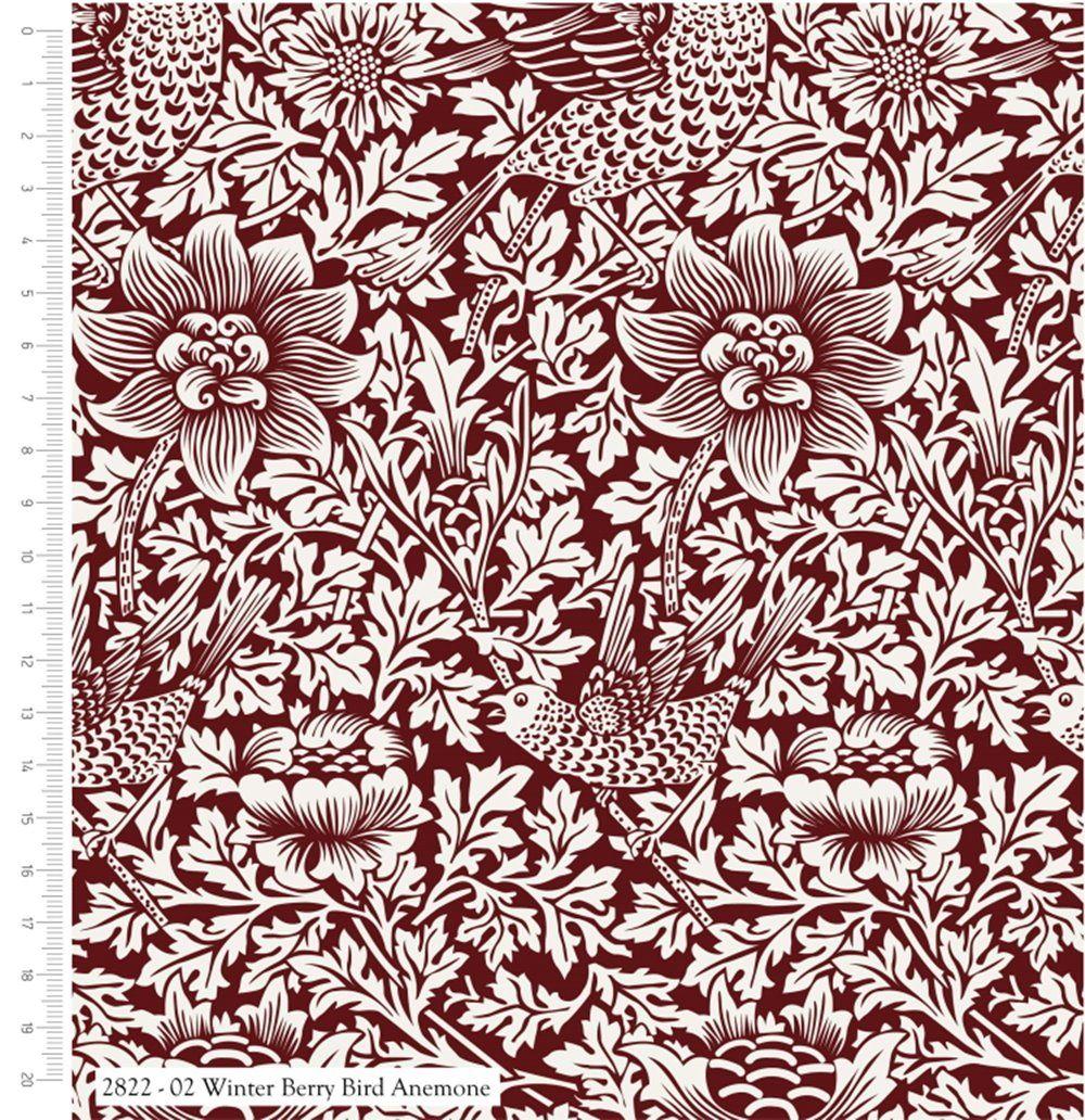 A piece of red and white Quilt fabric featuring a design of birds and flowers, part of the William Morris Winter Berry Collection.