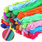 A collection of colorful elastic bands in various colors including black, blue, green, orange, pink, red, and yellow.